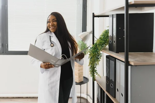 An African American female medical doctor with a stethoscope in hospital