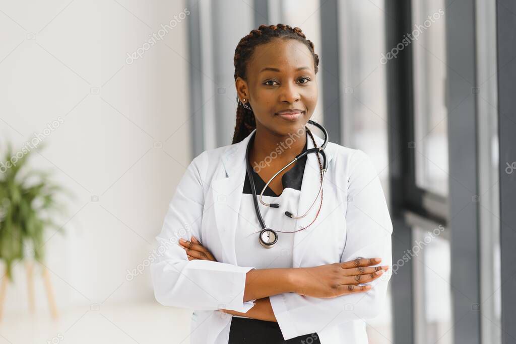 beautiful african american nurse with arms folded