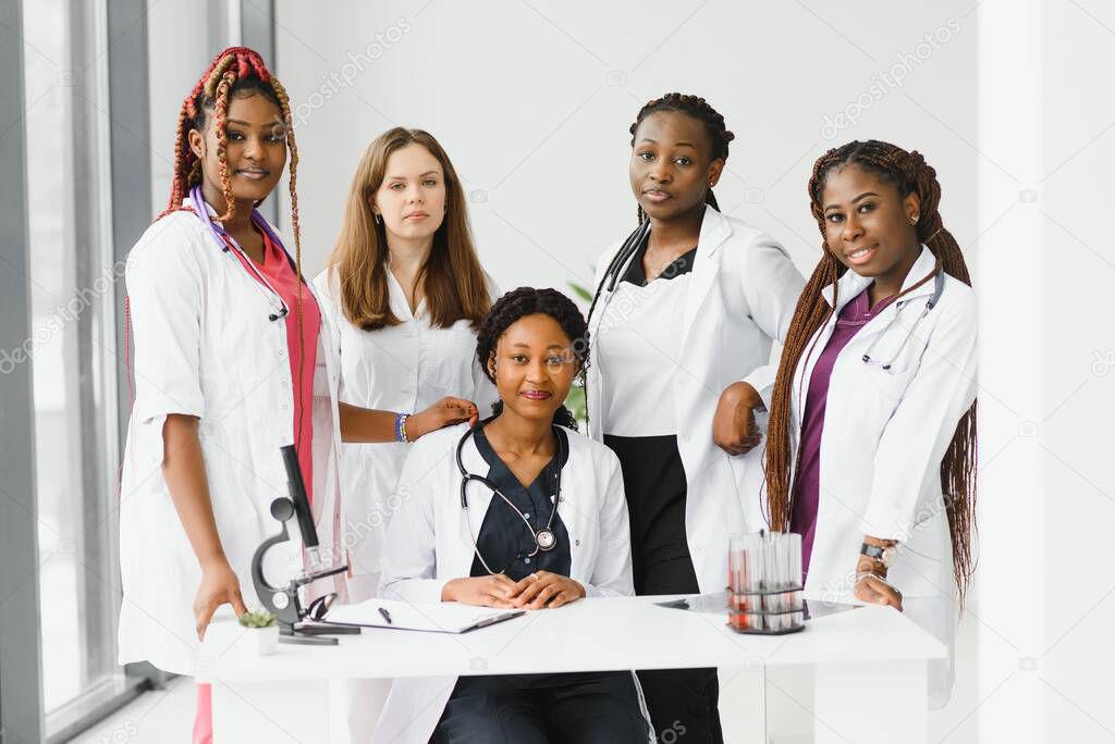 African-American black doctor woman and medical group