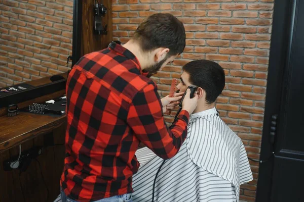 Men\'s haircut at the barber scissors