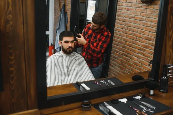 Men's haircut at the barber scissors