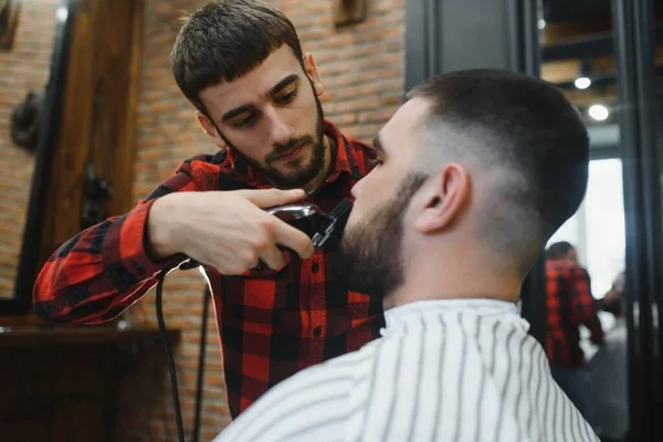 Bearded man, bearded male. Vintage barbershop, shaving. Portrait of stylish man beard. Barber scissors and straight razor, barber shop. Beard styling. Advertising barber shop concept. Black and white