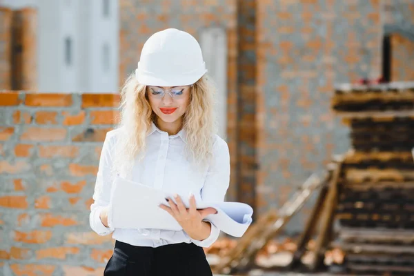 A portrait of engineer woman looking construction. Concept Engineer and business work.