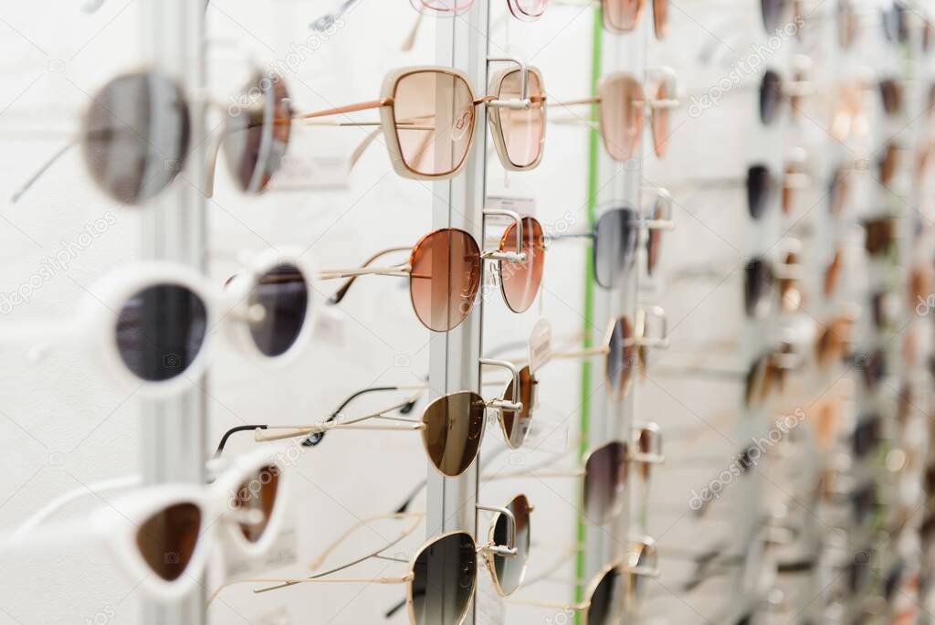 fashionable sunglasses on the shop shelf