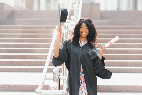 Excited African American woman at her graduation.