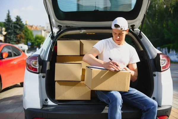 Young Delivery Man Checking List Clipboard Car — Stock Photo, Image