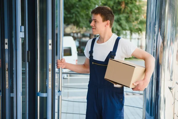 happy delivery man with box