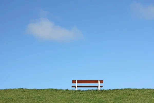 Bench on a dike — Stok Foto