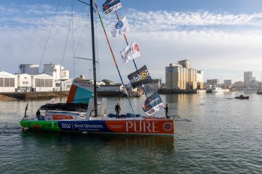 LES SABLES D'OLONNE, FRANCE - NOVEMBER 08, 2020: Romain Attanasio boat (Pure - Best Western) in the channel for the start of the Vendee Globe 2020 on November 08,2020. in Les Sables d'Olonne, France.