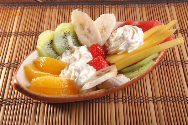 Fruit with cream in the Asian style — Stock Photo, Image