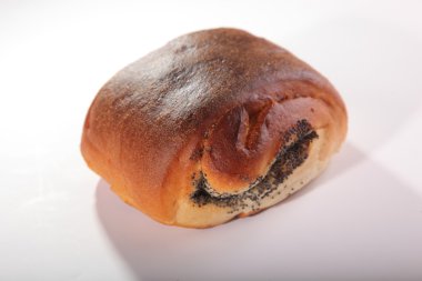 topuz ile beyaz zemin üzerine haşhaş tohumu