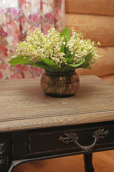 bouquet of lilies in a vase on the table