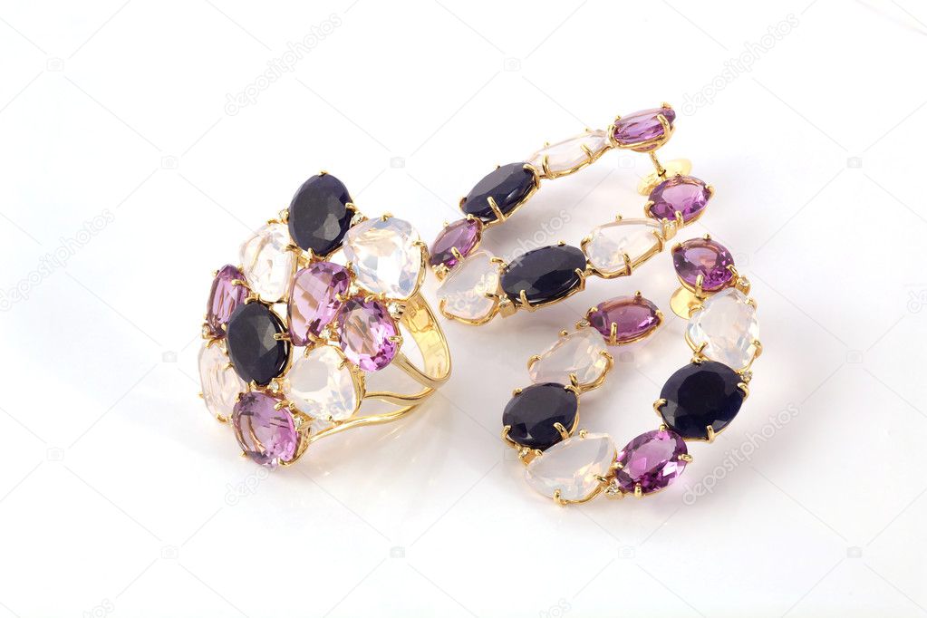 jewellery with precious stones on white background