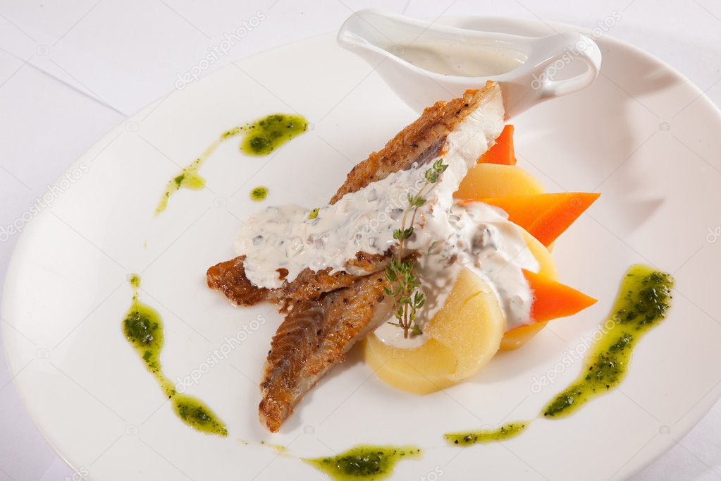 mackerel with sauce on white plate