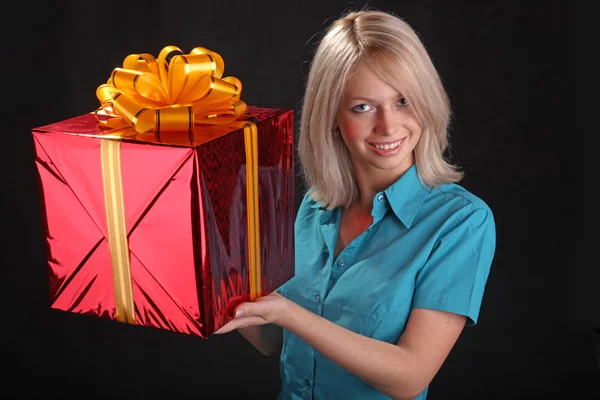 Blonde Smiling Holding Gift Black Background Royalty Free Stock Photos