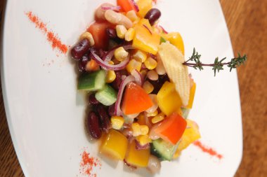 Salad with beans and corn on plate