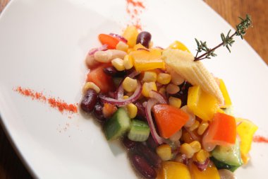 Salad with beans and corn on plate