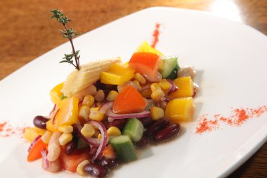 Salad with beans and corn on plate