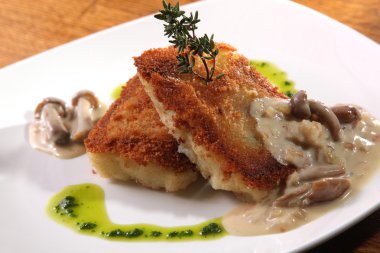 potato cutlets with mushroom sauce on plate