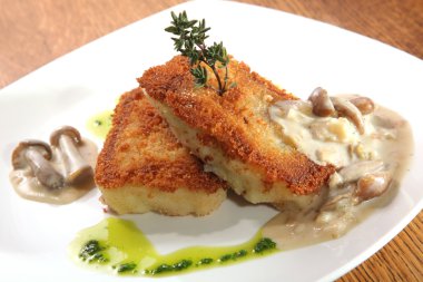 potato cutlets with mushroom sauce on plate