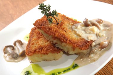 potato cutlets with mushroom sauce on plate