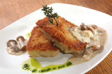 potato cutlets with mushroom sauce on plate