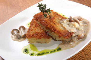 potato cutlets with mushroom sauce on plate