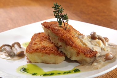 potato cutlets with mushroom sauce on plate