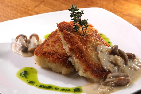 potato cutlets with mushroom sauce on plate