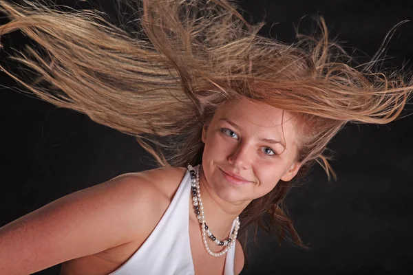 developing in the wind the hair on black background