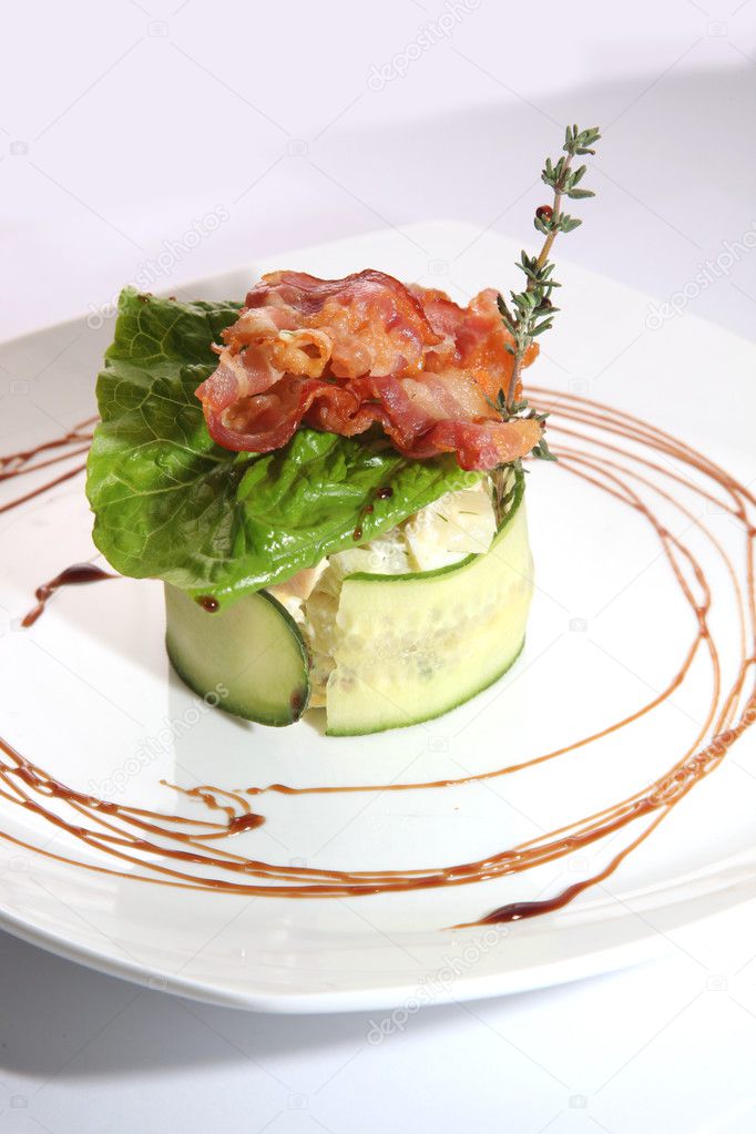 Russian salad with cucumber and Bacon on plate