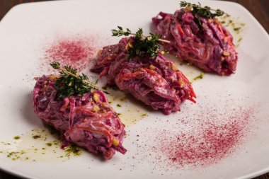 Salad with beets and pork on plate
