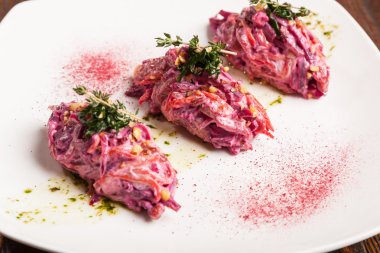 Salad with beets and pork on plate