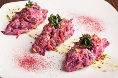 Salad with beets and pork on plate