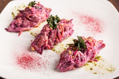 Salad with beets and pork on plate