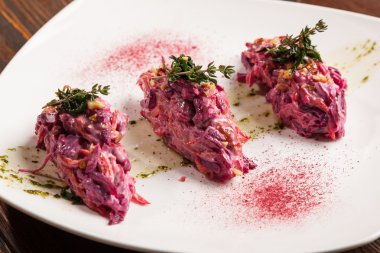 Salad with beets and pork on plate