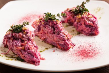 Salad with beets and pork on plate