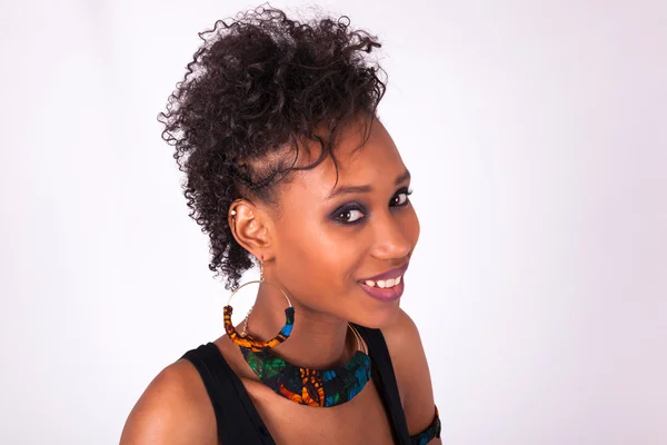 Beautiful African American woman with curly hairs isolated on wh — Stock Photo, Image