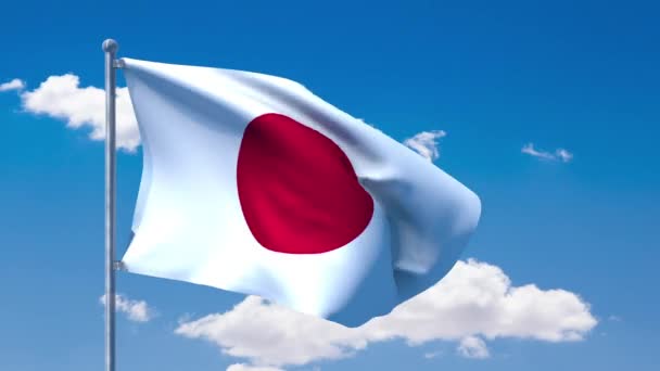 Bandera japonesa ondeando sobre un cielo azul nublado — Vídeo de stock