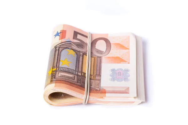 50 billets de banque en euros empilés et roulés ensemble — Photo