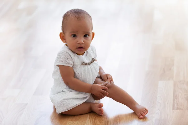 Portrait of little African American little girl sitting on the f — Stock Photo, Image