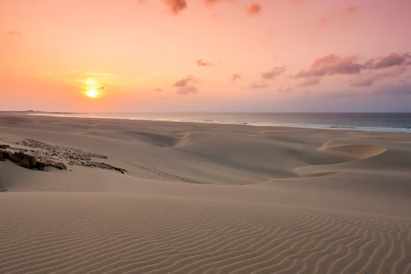 Sunset on sand dunes  in Chaves beach Praia de Chaves in Boavist