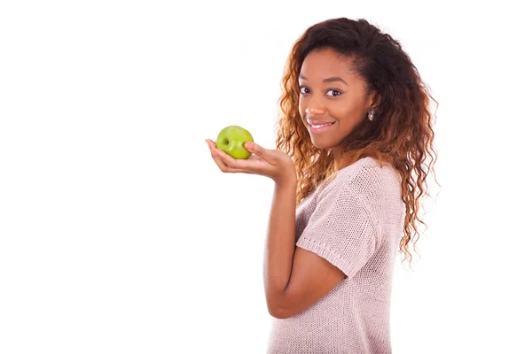 African Americanyoung woman holding one green apple - Black peop — Stock Photo, Image