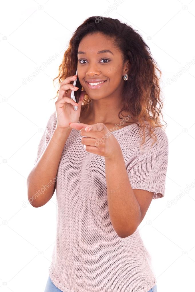 Young African American woman making a phone call on her smartpho