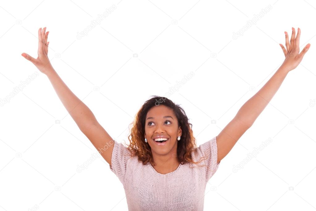 Successful african american woman with arms up expressing her jo