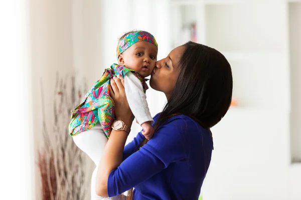 Young african american mother playing with her baby girl — Stock Photo, Image