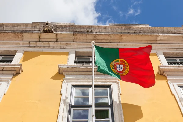 Portugal flag waving on the wind in front an administrative buil — Stock Photo, Image