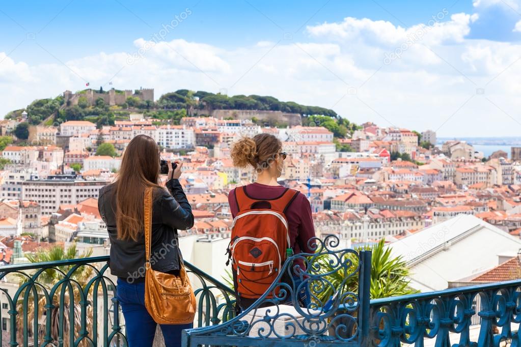 Tourist watching to Lisbon rooftop from Sao Pedro de Alcantara v