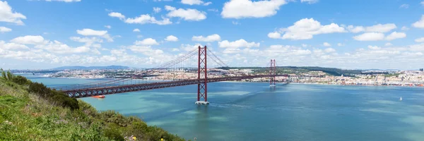 Panoramic view of 25 de Abril (April) Bridge in Lisbon - Portugal — стоковое фото