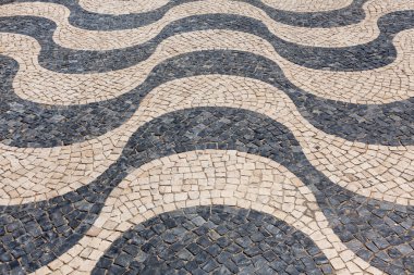 Typical Portuguese cobblestone hand-made pavement calçada